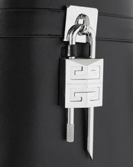 Shark Lock embellished glossed-leather knee boots